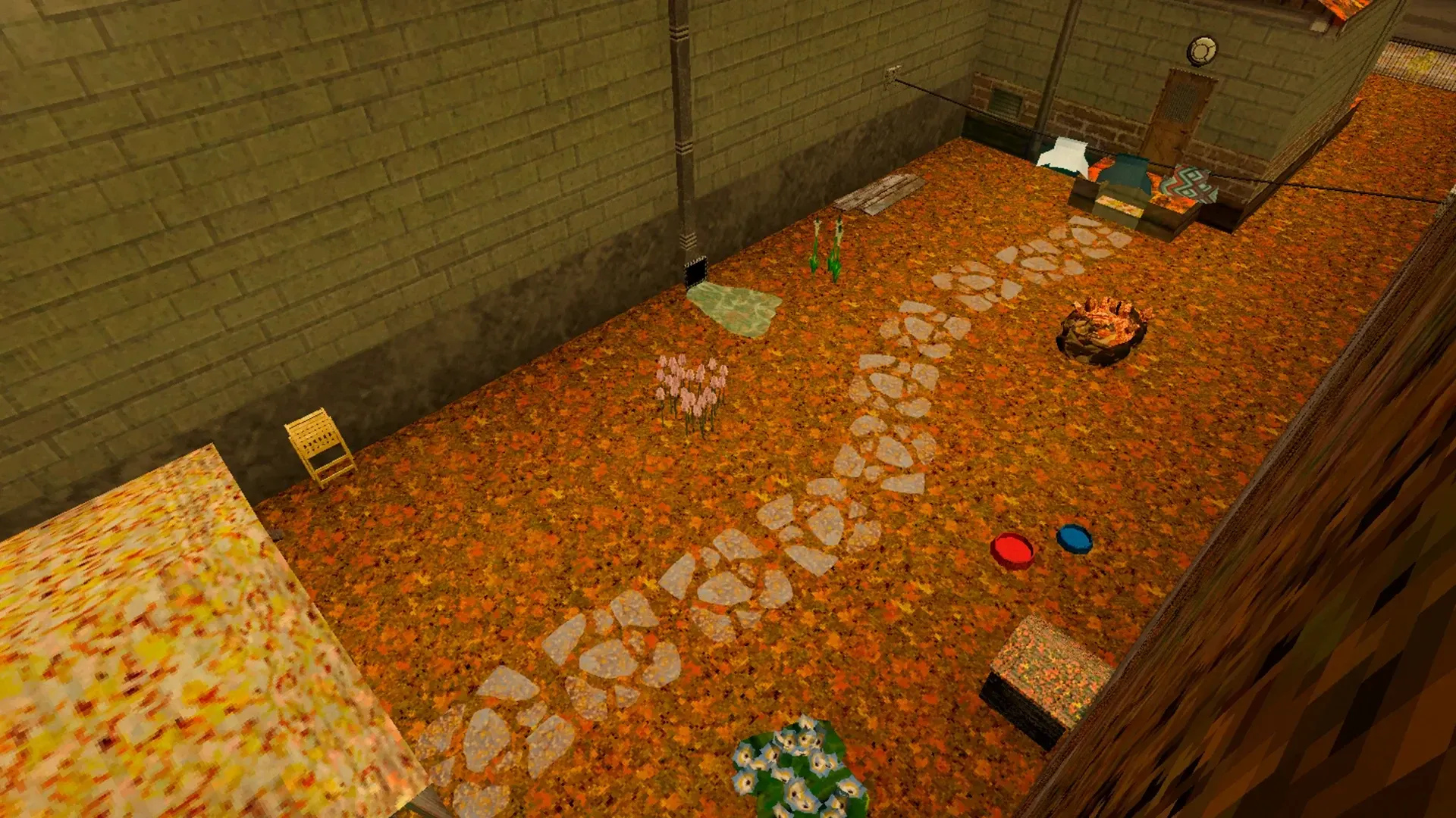 The garden in autumn from above, covered in orange fallen leaves