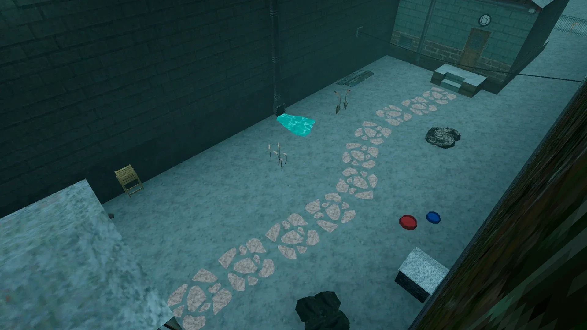 The garden in winter from above, covered in snow under a bluish light